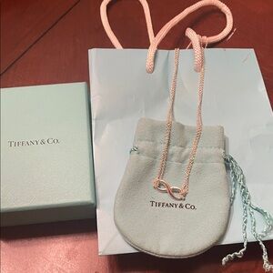 Authentic Tiffany & Co. Silver 18 in 
Infinity Pendent.